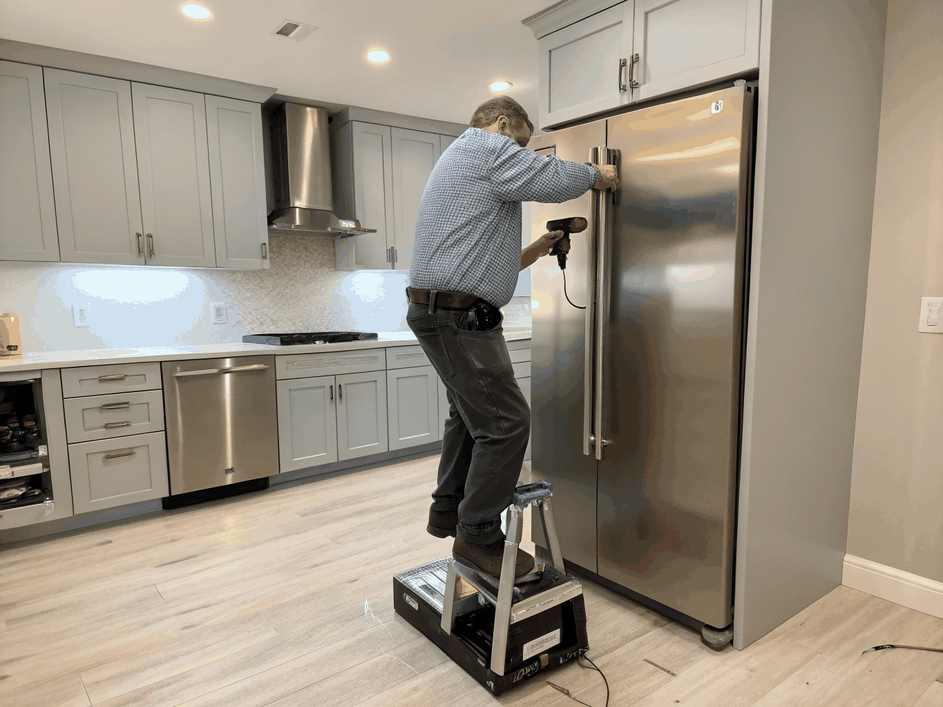 Technician repairing a Whirlpool home appliance